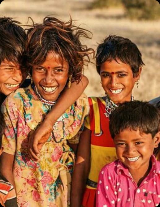 Children receiving nutritious meals through Annam Brahma community food support