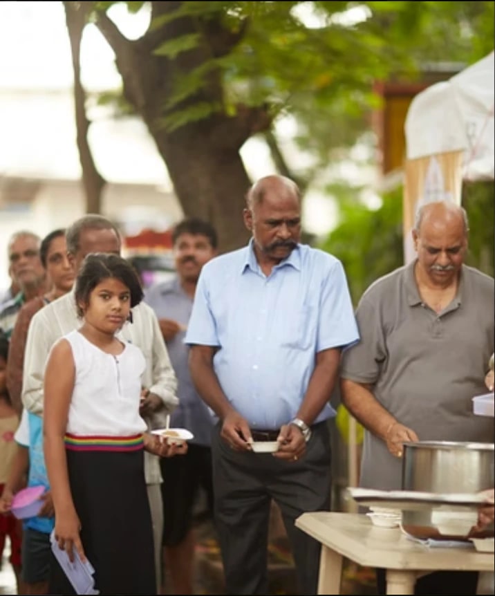 Community members waiting to receive food