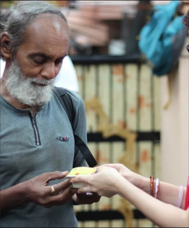 Elderly man being served